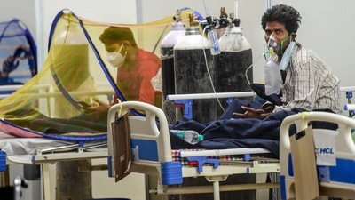Covid-19 patients receive treatment inside CWG Covid Care Centre in New Delhi. (PTI file photo) Covid-19 patients receive treatment inside CWG Covid Care Centre in New Delhi. (PTI file photo)