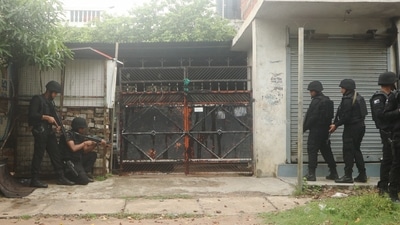 Uttar Pradesh ATS personnel outside the house in Lucknow from where two accused associated with Al-Qaeda were arrested on Sunday. (PTI Photo) Uttar Pradesh ATS personnel outside the house in Lucknow from where two accused associated with Al-Qaeda were arrested on Sunday. (PTI Photo)