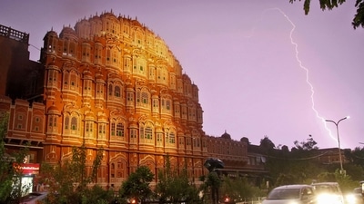 Vehicles are seen near the Hawa Mahal in Jaipur during a lightning strike on Sunday. (PTI Photo) Vehicles are seen near the Hawa Mahal in Jaipur during a lightning strike on Sunday. (PTI Photo)