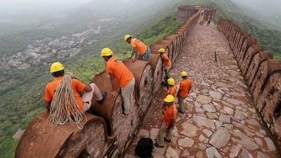 Members of the SDRF conduct a search operation after a lightning strike near Amer Fort in Jaipur on Monday. (PTI) Members of the SDRF conduct a search operation after a lightning strike near Amer Fort in Jaipur on Monday. (PTI)