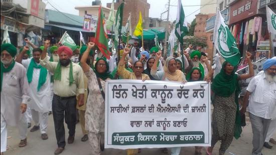 Farmers during a protest march at Dhanaula in