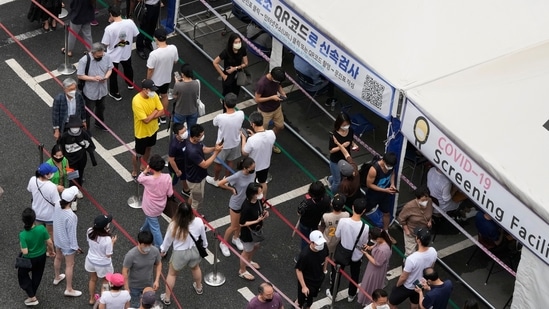 People queue in line to wait to get tested for Covid-19 at a Public Health Center in Seoul on July 11, 2021. (AP Photo) People queue in line to wait to get tested for Covid-19 at a Public Health Center in Seoul on July 11, 2021. (AP Photo)
