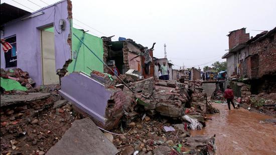 Local residents inspect the debris of their houses that were damaged by flash floods after heavy monsoon rains on the outskirts of Jammu on Monday. (AFP) Local residents inspect the debris of their houses that were damaged by flash floods after heavy monsoon rains on the outskirts of Jammu on Monday. (AFP)