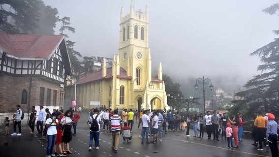 Visitors at Ridge, in Shimla during this past weekend on July 11. Images on social media also showed tourist frenzy at Atal Tunnel in Manali, at Kempty Falls in Mussoorie and several other tourist locations in the hills. This has led to concerns among health experts and officials over a possible rise in cases of Covid-19 again.(Deepak Sansta / HT Photo)