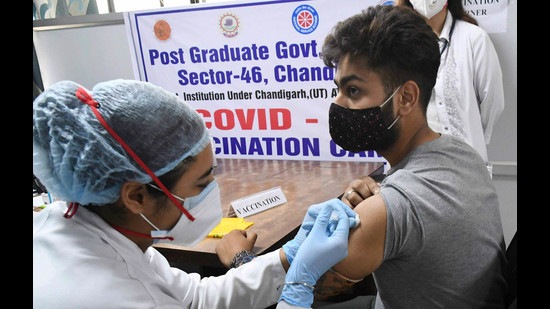 A student getting vaccinated at a special camp for college students and teachers at Post-Graduate Government College in Sector 46, Chandigarh, on Monday. (Keshav Singh/HT)