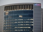 The logo of the Adani Group is seen on the facade of one of its buildings on the outskirts of Ahmedabad.(REUTERS) The logo of the Adani Group is seen on the facade of one of its buildings on the outskirts of Ahmedabad.(REUTERS)