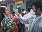 A BMC worker collects sample of a passenger for Covid-19 test, at a train station in Mumbai on Sunday.(PTI Photo) A BMC worker collects sample of a passenger for Covid-19 test, at a train station in Mumbai on Sunday.(PTI Photo)