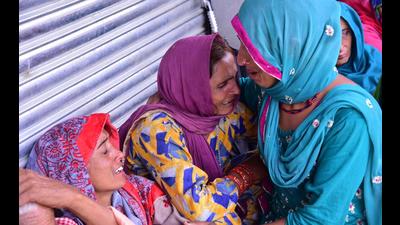 Women grieve for their dead relatives in a landslide after heavy rains at Boh village in Kangra district on Tuesday (HT Photo) Women grieve for their dead relatives in a landslide after heavy rains at Boh village in Kangra district on Tuesday (HT Photo)
