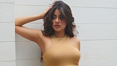 Janhvi recently stepped out in Mumbai in the 'Camel Ruched Mesh Overlay Dress by Club L London' by Frisky. (Instagram) Janhvi recently stepped out in Mumbai in the 'Camel Ruched Mesh Overlay Dress by Club L London' by Frisky. (Instagram)