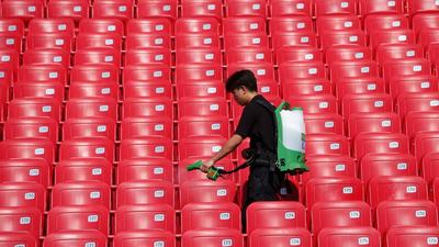 A Calgary Stampede festival worker sanitises seats before the start of a rodeo in Calgary, Alberta, Canada. (REUTERS/FILE) A Calgary Stampede festival worker sanitises seats before the start of a rodeo in Calgary, Alberta, Canada. (REUTERS/FILE)
