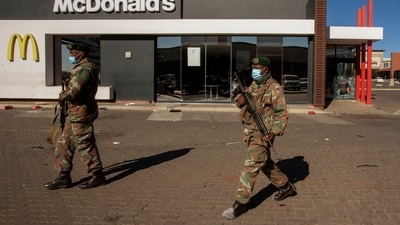 Soldiers patrol at a shopping centre in Soweto, Johannesburg, Tuesday July 13, 2021. (AP) Soldiers patrol at a shopping centre in Soweto, Johannesburg, Tuesday July 13, 2021. (AP)