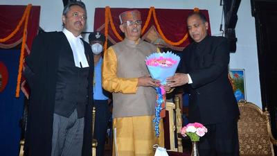 Chief minister Jai Ram Thakur felicitating Rajendra Arlekar (centre) after he was sworn in as the governor of Himachal Pradesh as acting chief justice of the high court, justice Ravi Malimath, looks on in Shimla on Tuesday. (HT Photo) Chief minister Jai Ram Thakur felicitating Rajendra Arlekar (centre) after he was sworn in as the governor of Himachal Pradesh as acting chief justice of the high court, justice Ravi Malimath, looks on in Shimla on Tuesday. (HT Photo)