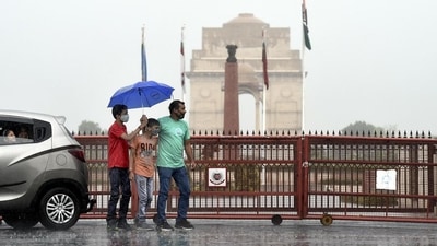 People are seen near India Gate in New Delhi as it rains. (HT Photo) People are seen near India Gate in New Delhi as it rains. (HT Photo)