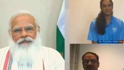PM Modi speaks with badminton player PV Sindhu and her parents during his interaction with India's Tokyo Olympics-bound athletes (Twitter/ANI)
