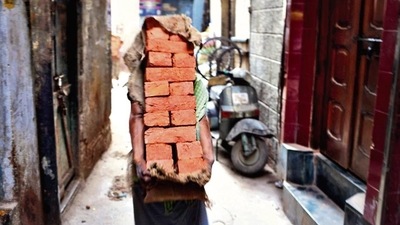 Kishore lives with a dozen other labourers, all from the same district in Bihar. (HT Photo)