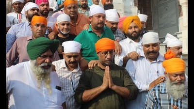 Former Punjab minister Anil Joshi (C) with his supporters at the Golden Temple in Amritsar.
