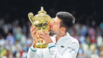 Novak Djokovic with the Wimbledon trophy after winning his final match against Italy's Matteo Berrettini on Sunday, July 11. (File photo) Novak Djokovic with the Wimbledon trophy after winning his final match against Italy's Matteo Berrettini on Sunday, July 11. (File photo)