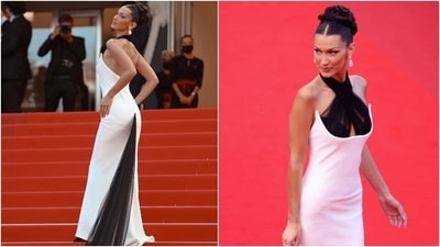 For her first look on the Cannes red carpet, Bella brought back the old Hollywood glamour in a vintage Jean Paul Gaultier column gown. The glamorous ensemble featured a dramatic black sheer train, which covered the Cannes red carpet and a halter neckline in the same black fabric. (Instagram/@bellahadid) For her first look on the Cannes red carpet, Bella brought back the old Hollywood glamour in a vintage Jean Paul Gaultier column gown. The glamorous ensemble featured a dramatic black sheer train, which covered the Cannes red carpet and a halter neckline in the same black fabric. (Instagram/@bellahadid)