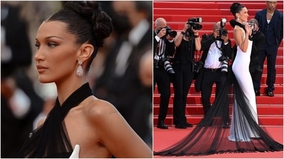 Bella wore her hair up in an elegant bun that was sleek and parted in the middle. She chose Chopard jewellery to accessorise her vintage look, including white gold earrings with two pear-shaped diamonds. (Instagram/@bellahadid) Bella wore her hair up in an elegant bun that was sleek and parted in the middle. She chose Chopard jewellery to accessorise her vintage look, including white gold earrings with two pear-shaped diamonds. (Instagram/@bellahadid)
