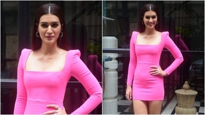 Kriti Sanon was clicked by the paparazzi looking her glamorous best today. The star chose a bright coloured outfit for her day out, and we are taking style cues. (Varinder Chawla) Kriti Sanon was clicked by the paparazzi looking her glamorous best today. The star chose a bright coloured outfit for her day out, and we are taking style cues. (Varinder Chawla)