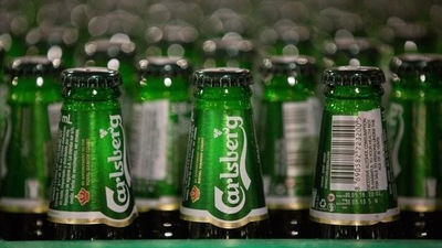 Green bottles of Carlsberg beer move along the production line. (Bloomberg for representative image) Green bottles of Carlsberg beer move along the production line. (Bloomberg for representative image)