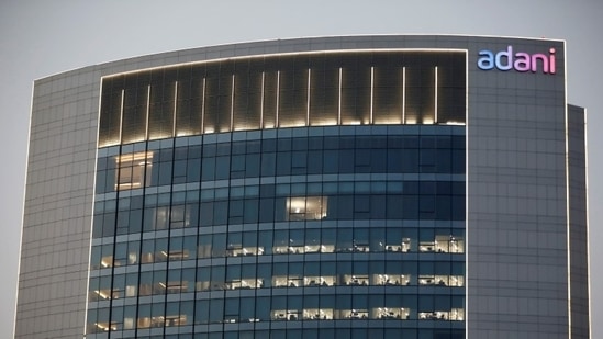 The logo of the Adani Group is seen on the facade of one of its buildings on the outskirts of Ahmedabad.(REUTERS)