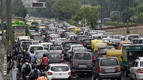 Heavy traffic on Ring Road, near the Millennium Park, due to water-logging after morning showers. (Photo by Ajay Aggarwal / Hindustan Times)