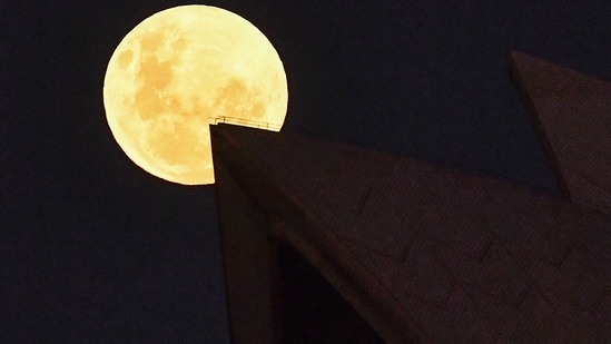 The moon's orbit causes high and low tides on Earth. Its gravitational pull generates something called the tidal force.(AFP File Photo)