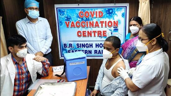 A beneficiary gets a shot of Covid-19 vaccine in a mobile vaccination train in Kolkata on Monday. (ANI)