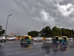 Commuters out in the rain near India Gate in New Delhi on July 13. Beginning with a short spell in the morning, the showers brought not just respite from heat, but also an end to a cycle of incorrect predictions about the arrival of the monsoon in the capital for IMD.(Arvind Yadav / HT Photo)