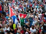 Members of an exiled Cuban community react to reports of protests in Cuba, against the deteriorating economy, in North Bergen, New Jersey, U.S.
