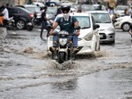 Vehicles make their way through flooded road after heavy rainfall at NH-24, in New Delhi on Wednesday. (ANI Photo) Vehicles make their way through flooded road after heavy rainfall at NH-24, in New Delhi on Wednesday. (ANI Photo)
