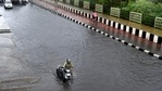 A motorist pushes a scooter past a waterlogged stretch during heavy rain near Vinod Nagar in New Delhi.(Ajay Aggarwal /HT PHOTO) A motorist pushes a scooter past a waterlogged stretch during heavy rain near Vinod Nagar in New Delhi.(Ajay Aggarwal /HT PHOTO)
