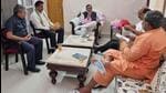 This photo showing Uttarakhand minister Swami Yatishwaranand hanging a facemask on his foot went viral in the state on Wednesday. (Sourced-Social media)