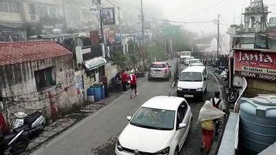 Vehicles seen on the road after the relaxation in Covid-19 restriction, in Mussoorie on Sunday. (ANI Photo)