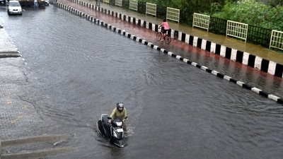 A motorist pushes a scooter past a waterlogged stretch during heavy rain near Vinod Nagar in New Delhi. (Ajay Aggarwal /HT PHOTO) A motorist pushes a scooter past a waterlogged stretch during heavy rain near Vinod Nagar in New Delhi. (Ajay Aggarwal /HT PHOTO)
