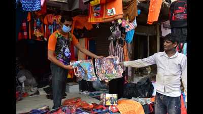 A shopkeeper in Daraganj, Prayagraj, selling items that are in great demand among kanwariyas. (Anil Kumar Maurya/HT) A shopkeeper in Daraganj, Prayagraj, selling items that are in great demand among kanwariyas. (Anil Kumar Maurya/HT)