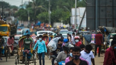 People leave the capital as the government loosened a lockdown imposed as a preventive measure against the Covid-19 coronavirus ahead of the Muslim festival of Eid al-Adha in Dhaka on July 13, 2021. (Photo by Munir Uz zaman / AFP) (AFP)