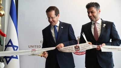 Israel's President Isaac Herzog, left, cuts a ribbon with United Arab Emirates Ambassador to Israel Mohamed Al Khaja during the opening ceremony for the new UAE Embassy in Tel Aviv, Israel. (AP) Israel's President Isaac Herzog, left, cuts a ribbon with United Arab Emirates Ambassador to Israel Mohamed Al Khaja during the opening ceremony for the new UAE Embassy in Tel Aviv, Israel. (AP)