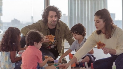 Sunny Leone, Daniel Weber and their three kids enjoying some pizza at their new home. Sunny Leone, Daniel Weber and their three kids enjoying some pizza at their new home.