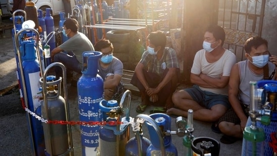 In picture - People line up with their tanks to refill oxygen during the Covid-19 outbreak in Yangon, Myanmar.(Reuters)