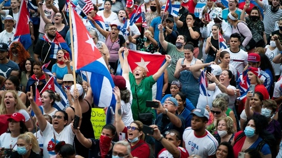 Members of an exiled Cuban community react to reports of protests in Cuba, against the deteriorating economy, in North Bergen, New Jersey, U.S.(REUTERS)