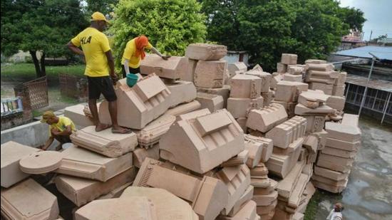 Workers cleaning stone blocks in Ayodhya. (PTI file photo) Workers cleaning stone blocks in Ayodhya. (PTI file photo)