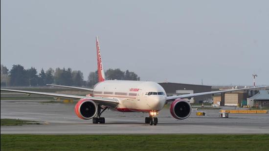 Air India flight 185 arrives from New Delhi, narrowly beating the cut-off after Canada’s government temporarily barred passenger flights from India, at Vancouver International Airport in Richmond, British Columbia, Canada, on April 23, 2021. (REUTERS)