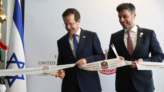 Israel's President Isaac Herzog, left, cuts a ribbon with United Arab Emirates Ambassador to Israel Mohamed Al Khaja during the opening ceremony for the new UAE Embassy in Tel Aviv, Israel.(AP)