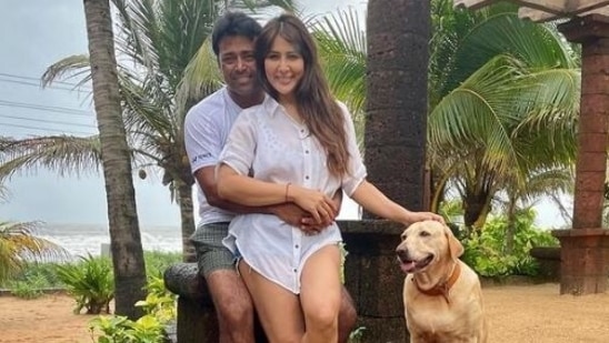 Leander Paes and Kim Sharma pose together.