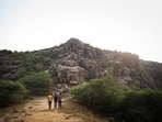 A view of mountains in the Aravalli Range where Palaeolithic cave paintings have been found, in Haryana on July 10. The caves are nestled amid a maze of quartzite rocks in the Aravalli mountain ranges, just outside the national capital, and a stone’s throw from the region’s only surviving patch of primary forest, a holy grove called Mangar Bani.(Sanchit Khanna / HT Photo)