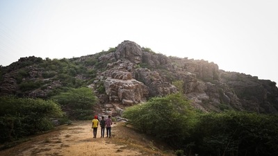 A view of mountains in the Aravalli Range where Palaeolithic cave paintings have been found, in Haryana on July 10. The caves are nestled amid a maze of quartzite rocks in the Aravalli mountain ranges, just outside the national capital, and a stone’s throw from the region’s only surviving patch of primary forest, a holy grove called Mangar Bani. (Sanchit Khanna / HT Photo) A view of mountains in the Aravalli Range where Palaeolithic cave paintings have been found, in Haryana on July 10. The caves are nestled amid a maze of quartzite rocks in the Aravalli mountain ranges, just outside the national capital, and a stone’s throw from the region’s only surviving patch of primary forest, a holy grove called Mangar Bani. (Sanchit Khanna / HT Photo)