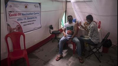A beneficiary gets inoculated against Covid-19 at a vaccination centre at Rafique Nagar, Govandi, in Mumbai on Wednesday, July 14. (Pratik Chorge/HT photo)