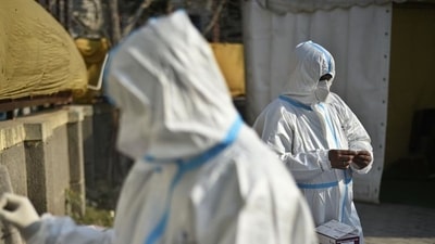 Health workers in PPE coveralls working at a temporary coronavirus testing facility set up at Sarai Kale Khan in New Delhi. (Biplov Bhuyan / HT file photo) Health workers in PPE coveralls working at a temporary coronavirus testing facility set up at Sarai Kale Khan in New Delhi. (Biplov Bhuyan / HT file photo)